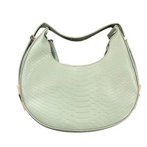 Saddle style adjustable straps light green handbag only used in a photo shoot